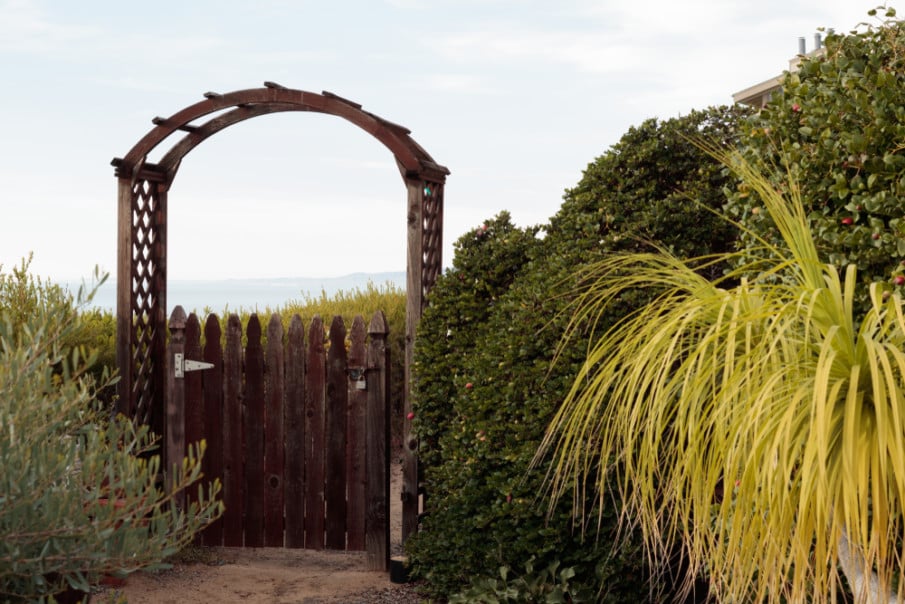Simple small wooden arbor with gate