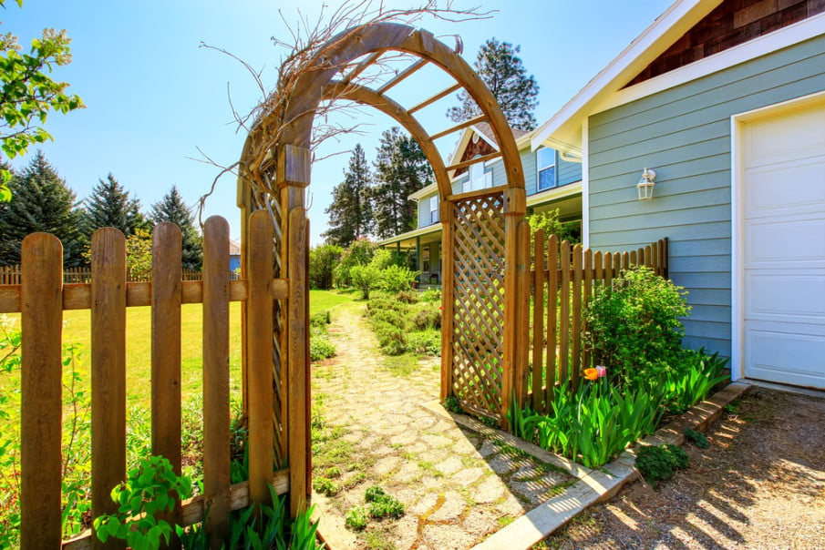 Wooden arbor with trellis and fence ideas