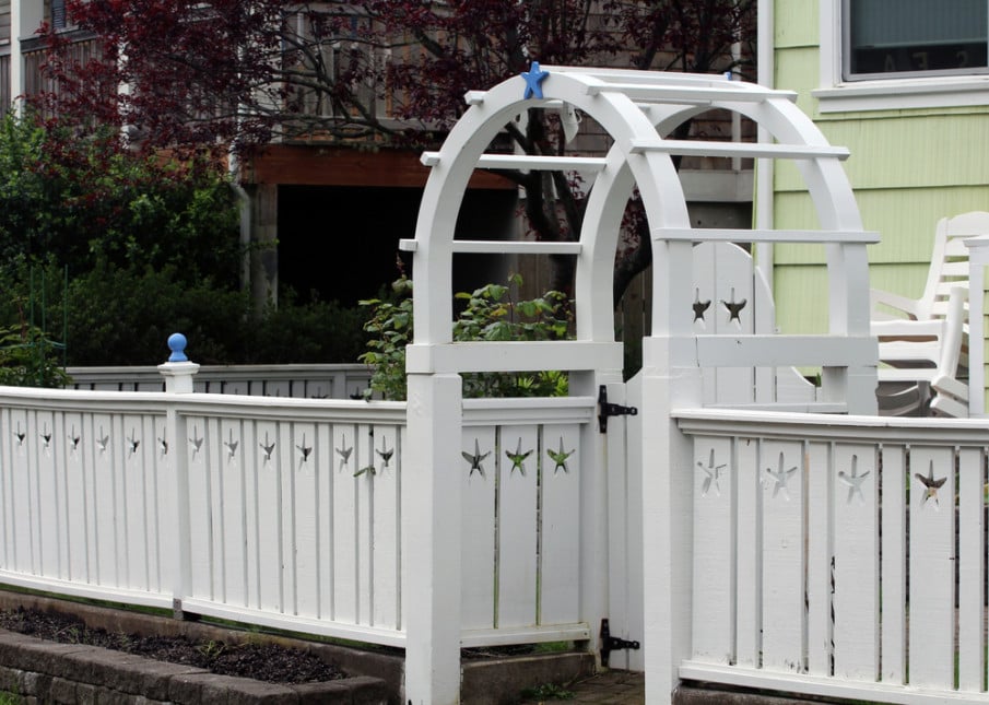 Arbor with gate and matching fence designs